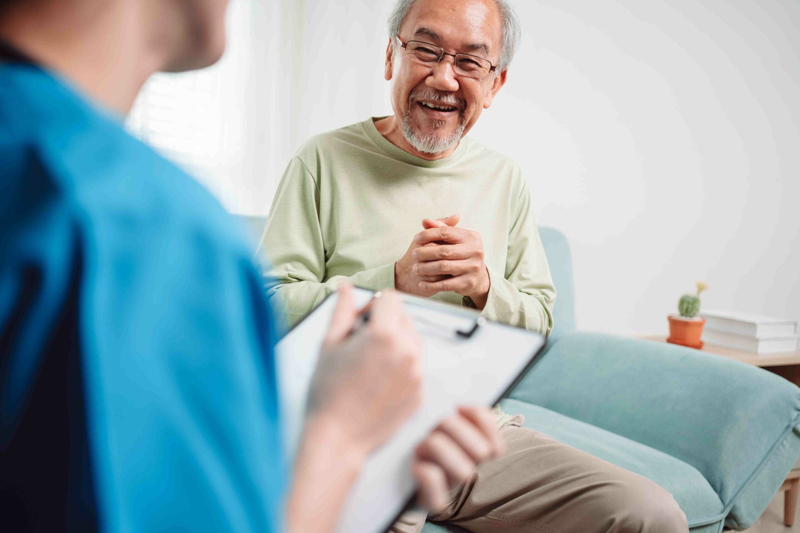 An older man chats with his specialist during a consultation at Quality Care Specialists in Maribyrnong