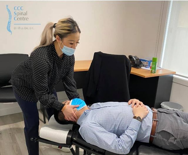 Dr Thuy Do with a patient undergoing chiropractic treatment