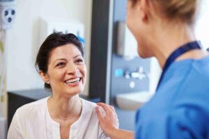 Older woman meeting her Quality Care Specialists doctor at her first appointment